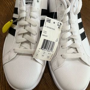 Brand new, tried on but not worn Adidas sneakers, ladies 9 M. (US size)